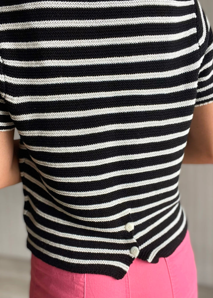 Women’s black and white striped short sleeve sweater with pink pants