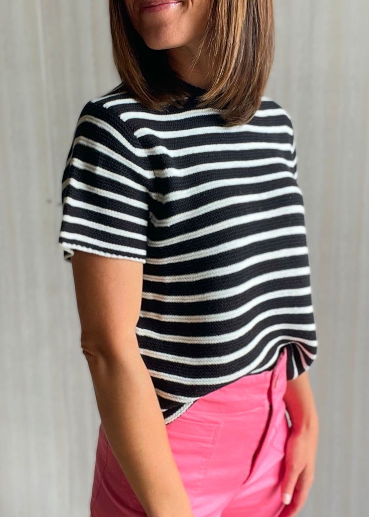 Women’s black and white striped short sleeve sweater with pink pants