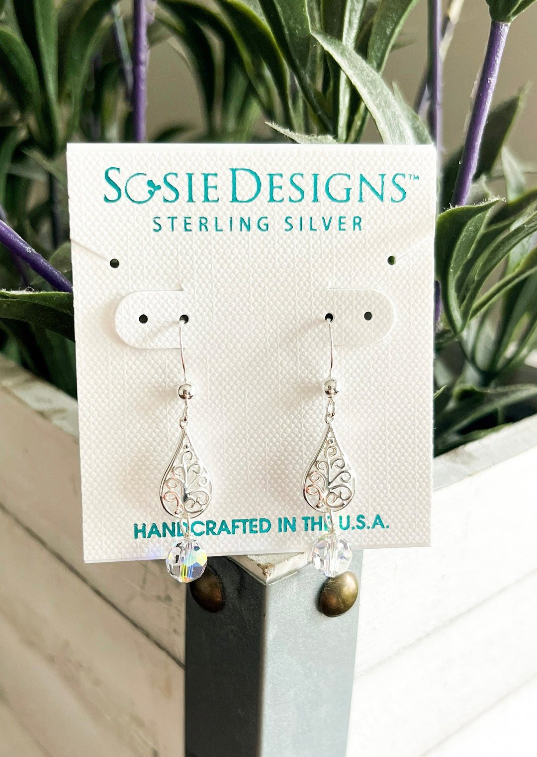 Sterling Silver design earrings with small crystal clear sparkles balls at the bottom.