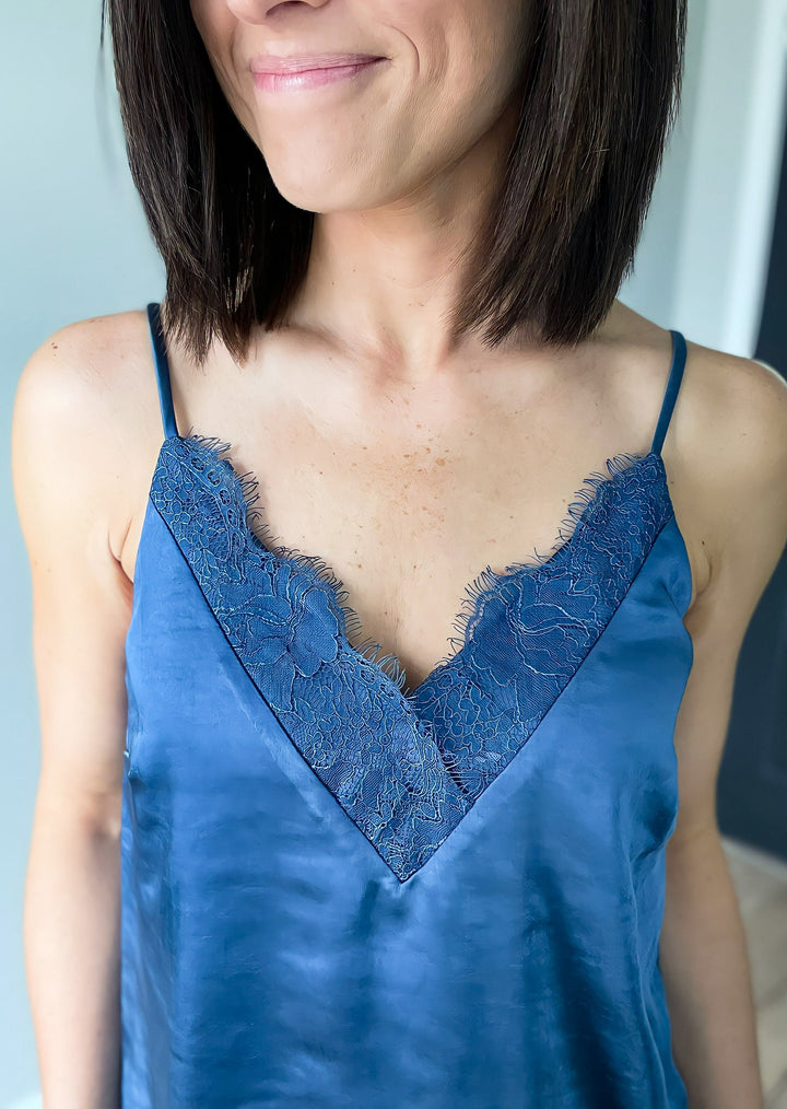 Smoky Blue Lace Camisole Top with adjustable straps, paired with white pants