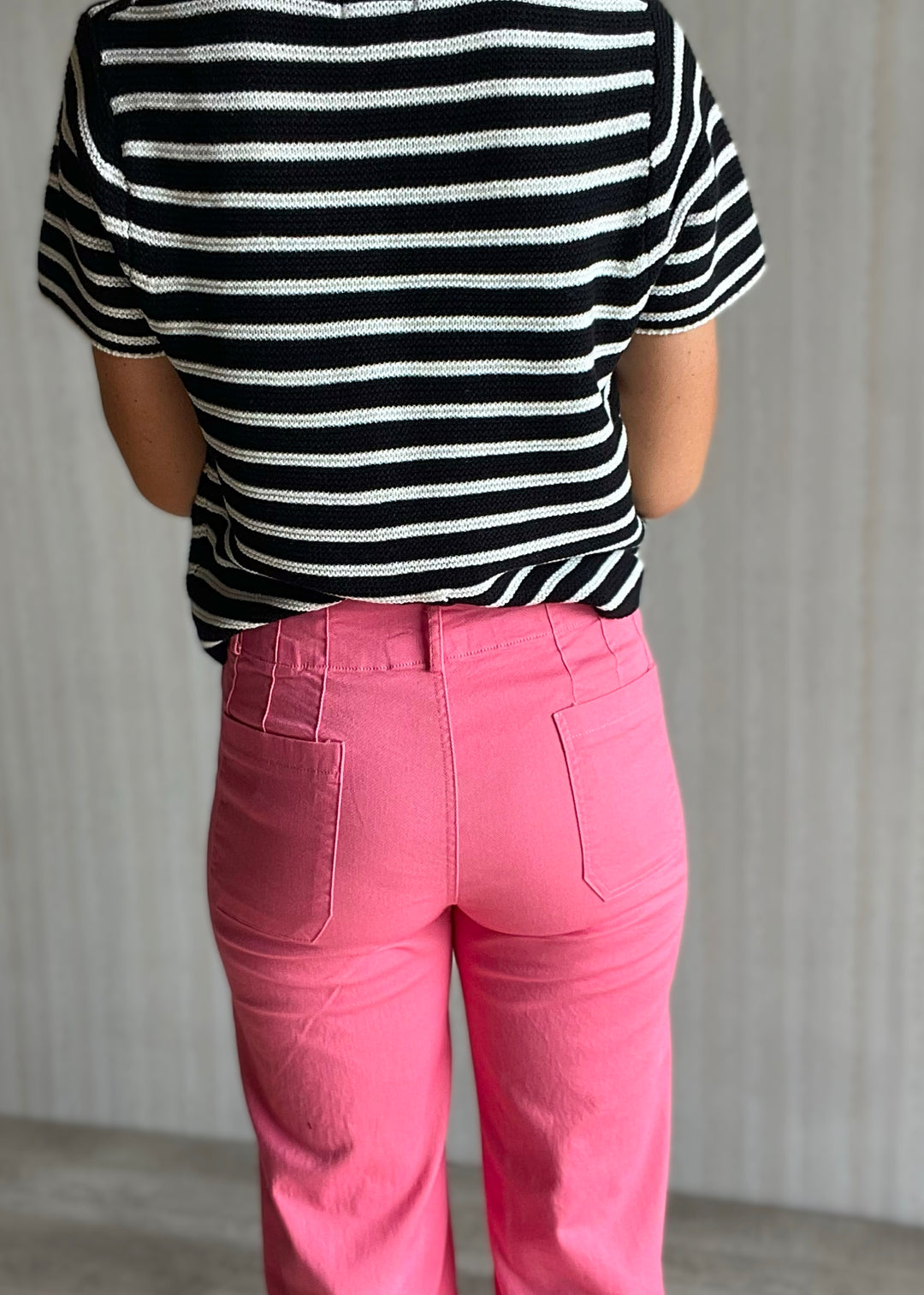 Cute Summer Outfit - Pink Cropped Wide Leg Pants with high waist paired with a light weight black and white striped short sleeve sweater