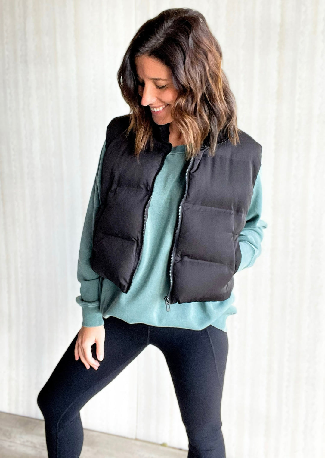 Washed Hunter Green Hangout Sweatshirt with black cropped puffer vest and black leggings