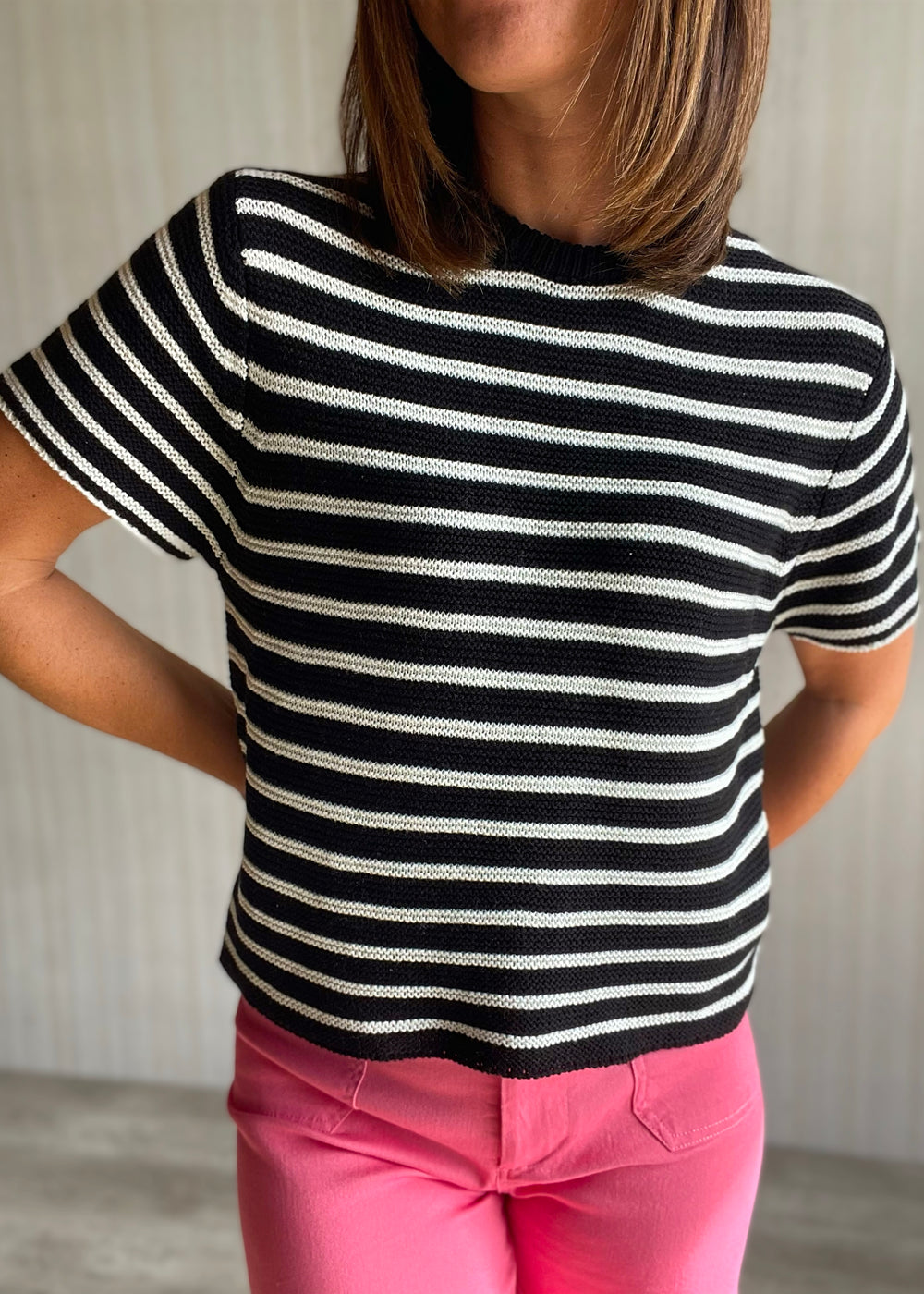 Women’s black and white striped short sleeve sweater with pink pants 