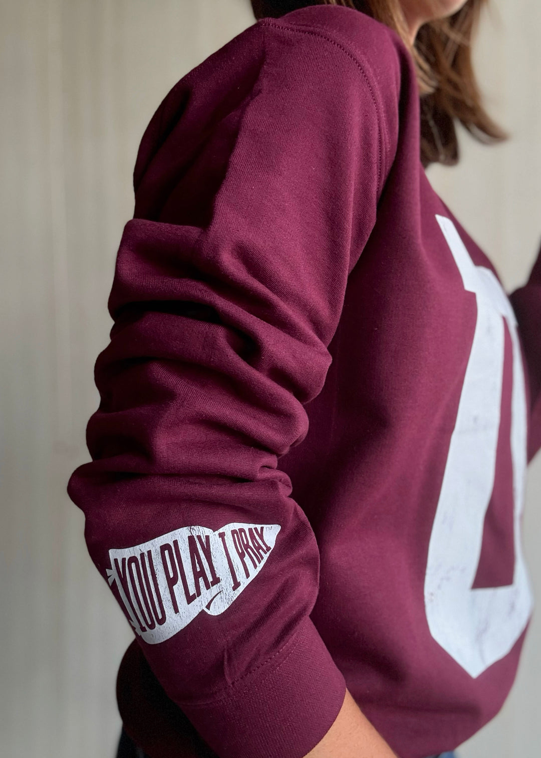 Maroon sweatshirt with a large white 'U' on a neutral background | Women's Unit Rockets Sweatshirt Fanwear