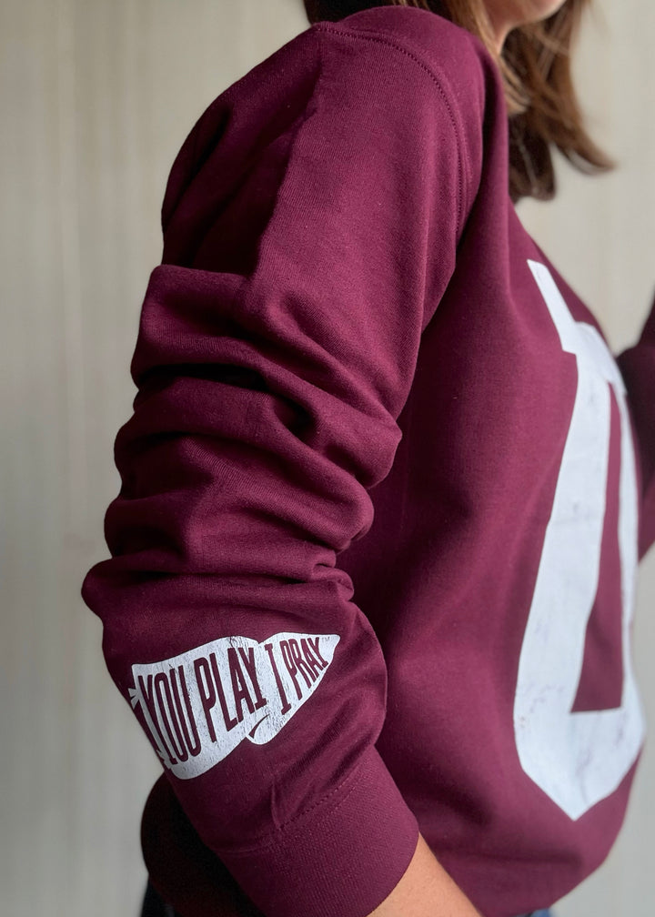 Maroon sweatshirt with a large white 'U' on a neutral background | Women's Unit Rockets Sweatshirt Fanwear
