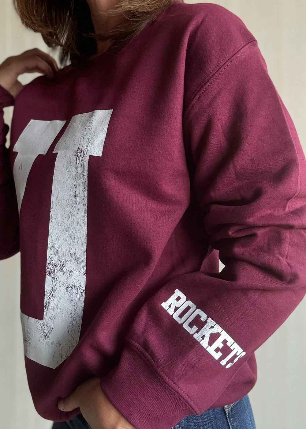 Maroon sweatshirt with a large white 'U' on a neutral background | Women's Unit Rockets Sweatshirt Fanwear