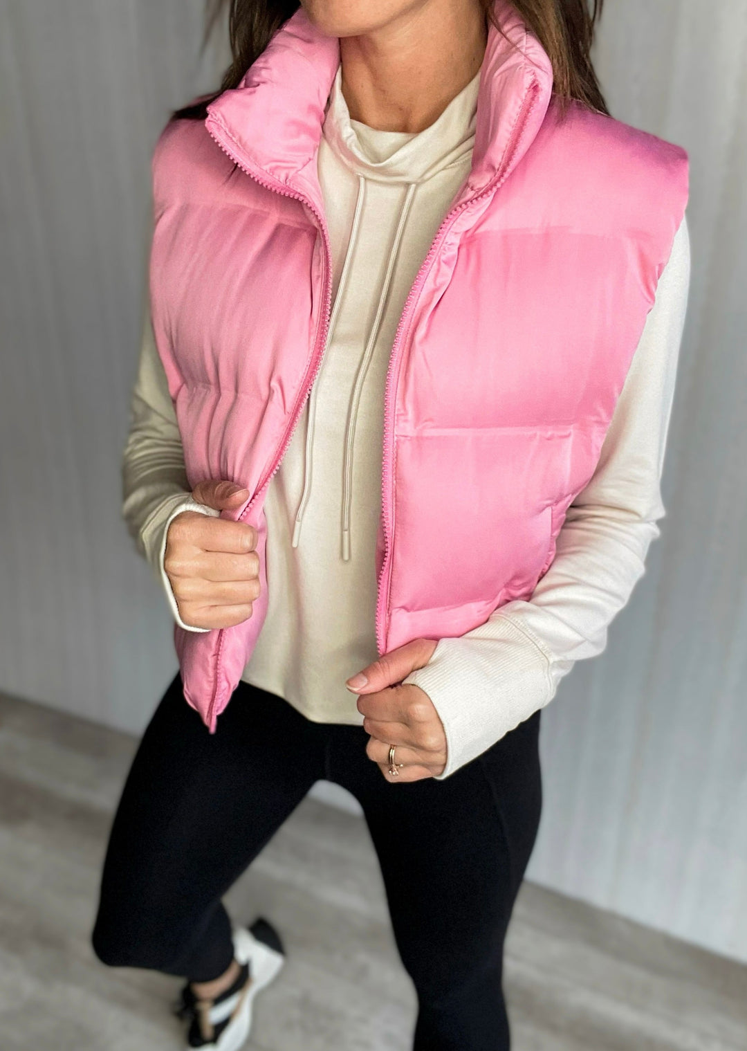 Cream Athleisure Top paired with a pink cropped puffer vest | How to wear cropped puffer vests