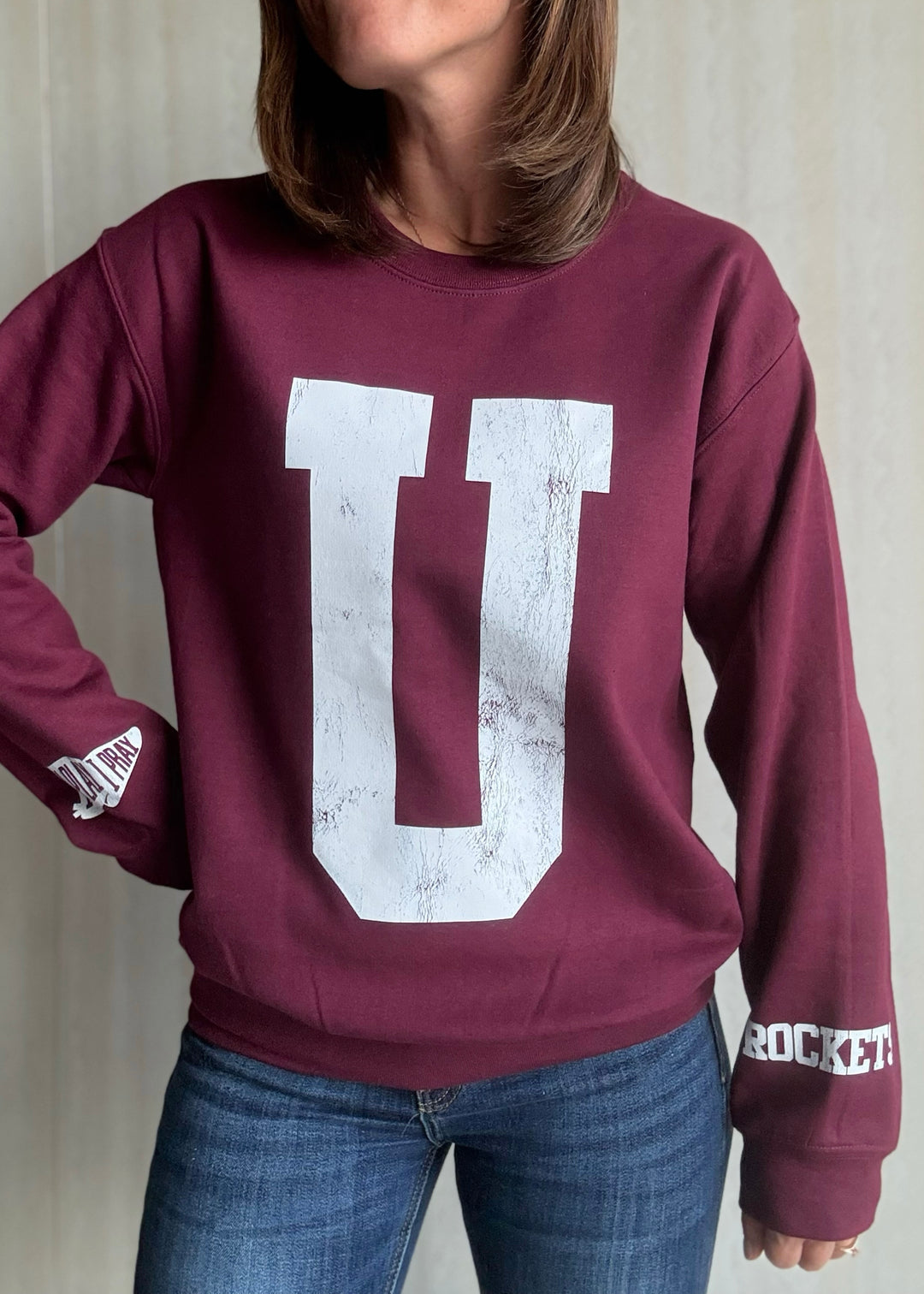 Maroon sweatshirt with a large white 'U' on a neutral background | Women's Unit Rockets Sweatshirt Fanwear