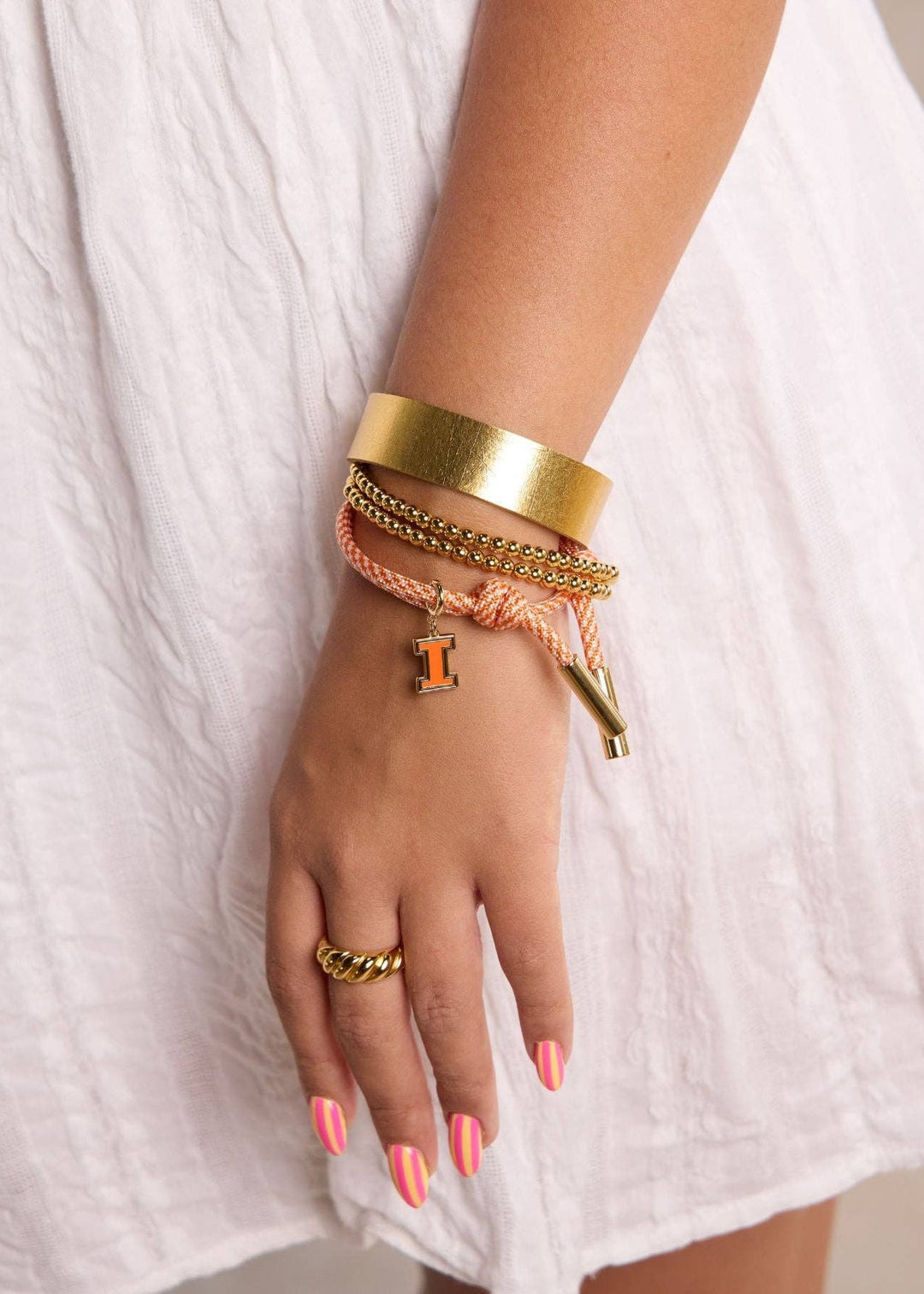 University of Illinois Enamel Charm on orange and white cord bracelet