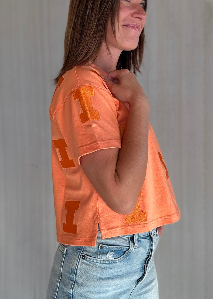 Women's Illinois Game Day Looks - Orange Sherbert Illinois Varsity "I" Repeat Tee | Cute Champaign-Urbana Game Day Outfits