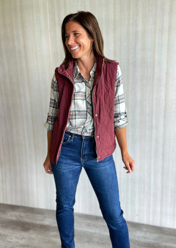 Maroon Burgundy Vest styled with maroon, white and gray plaid top and jeans. Thread and Supply Brand.