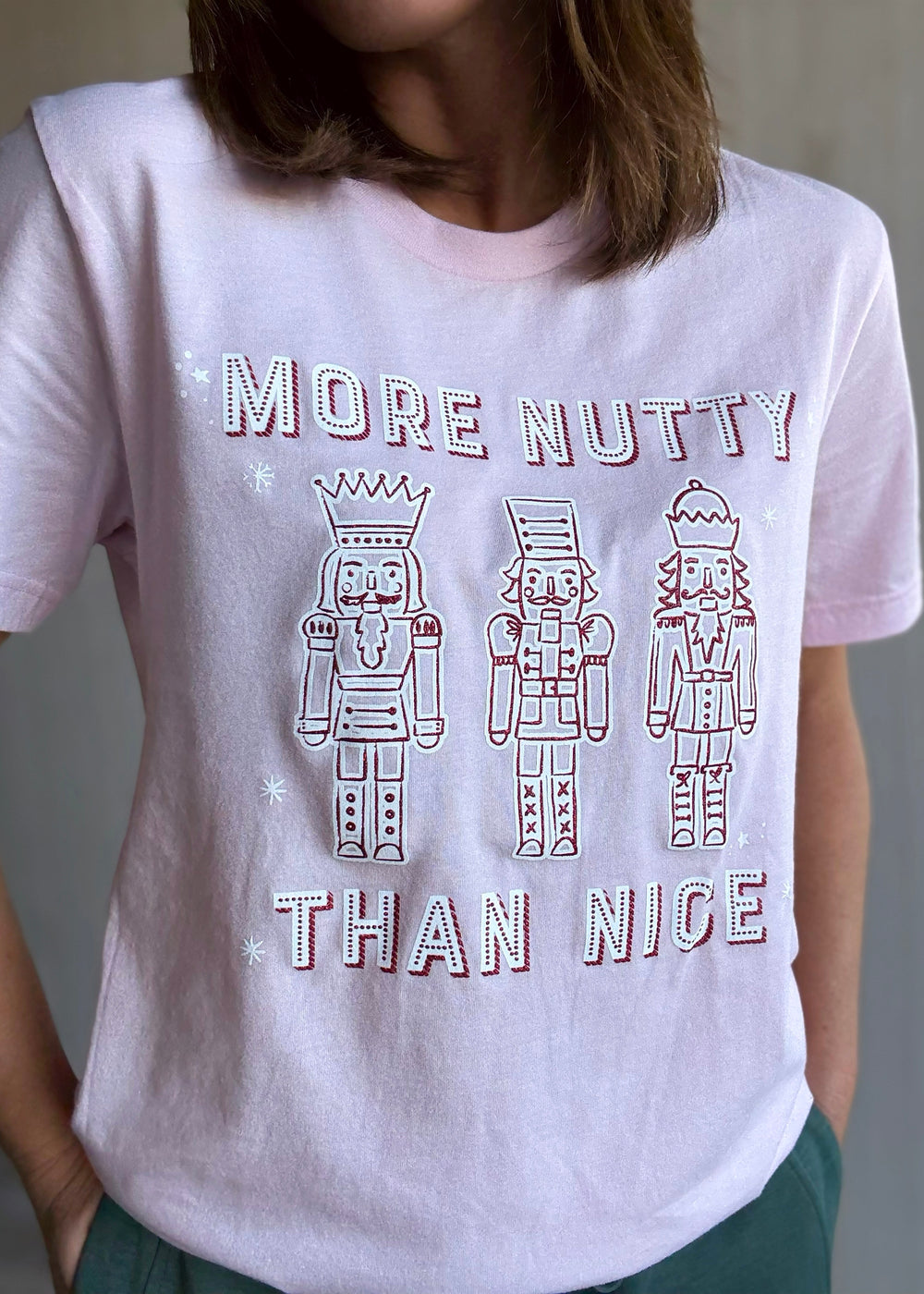 Women's Christmas Nutcracker t-shirt. Pink More Nutty Than Nice T-shirt