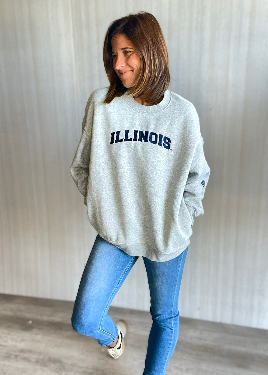 Women's Gray Illinois Pocket Crew Sweatshirt with jeans