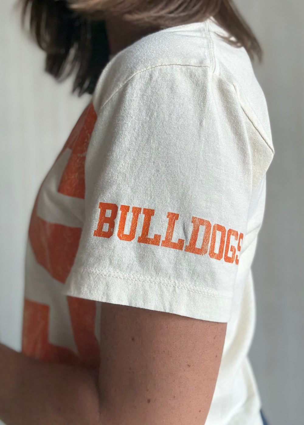 Women's Mahomet Seymour Cream and orange cropped t-shirt | Cute Mahomet Bulldogs Fanwear