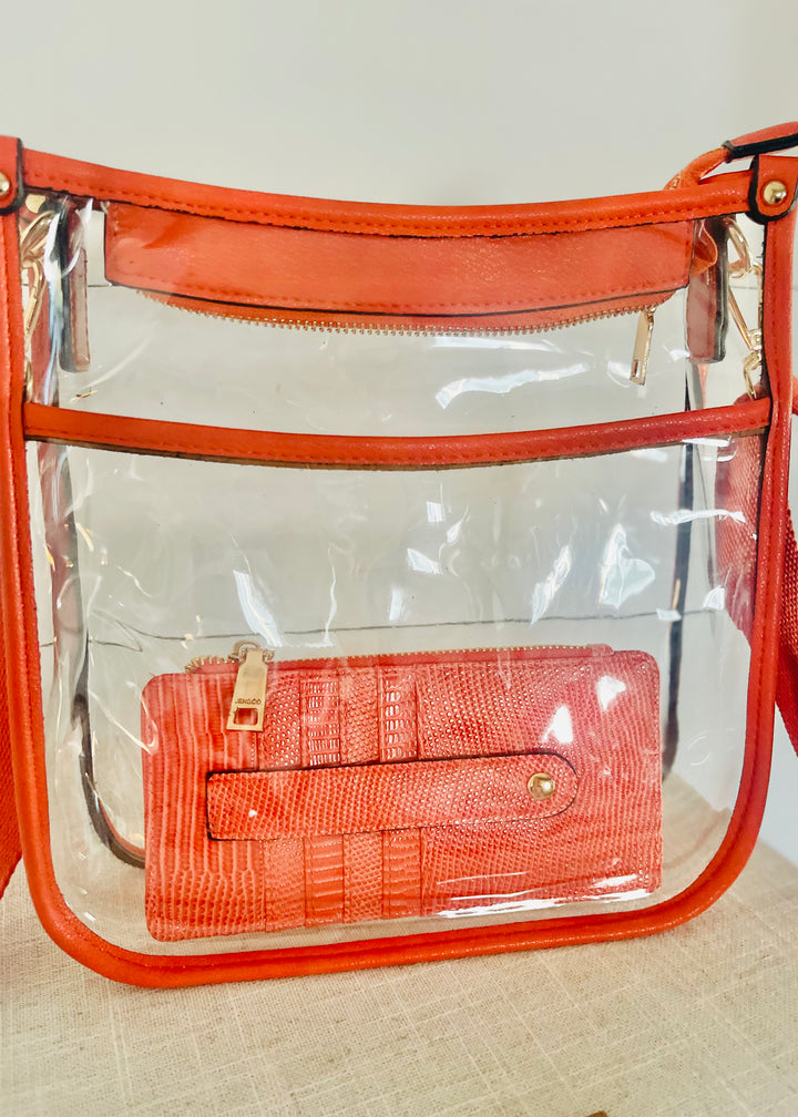 Coral Slim Card Holder in a clear orange bag. Perfect for game days!