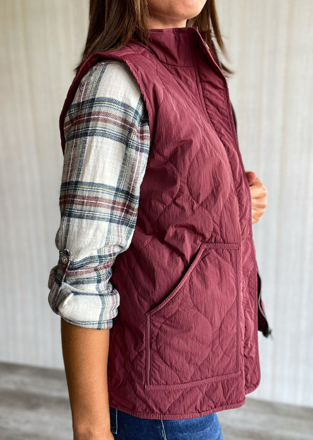 Maroon Burgundy Vest styled with maroon, white and gray plaid top and jeans. Thread and Supply Brand.