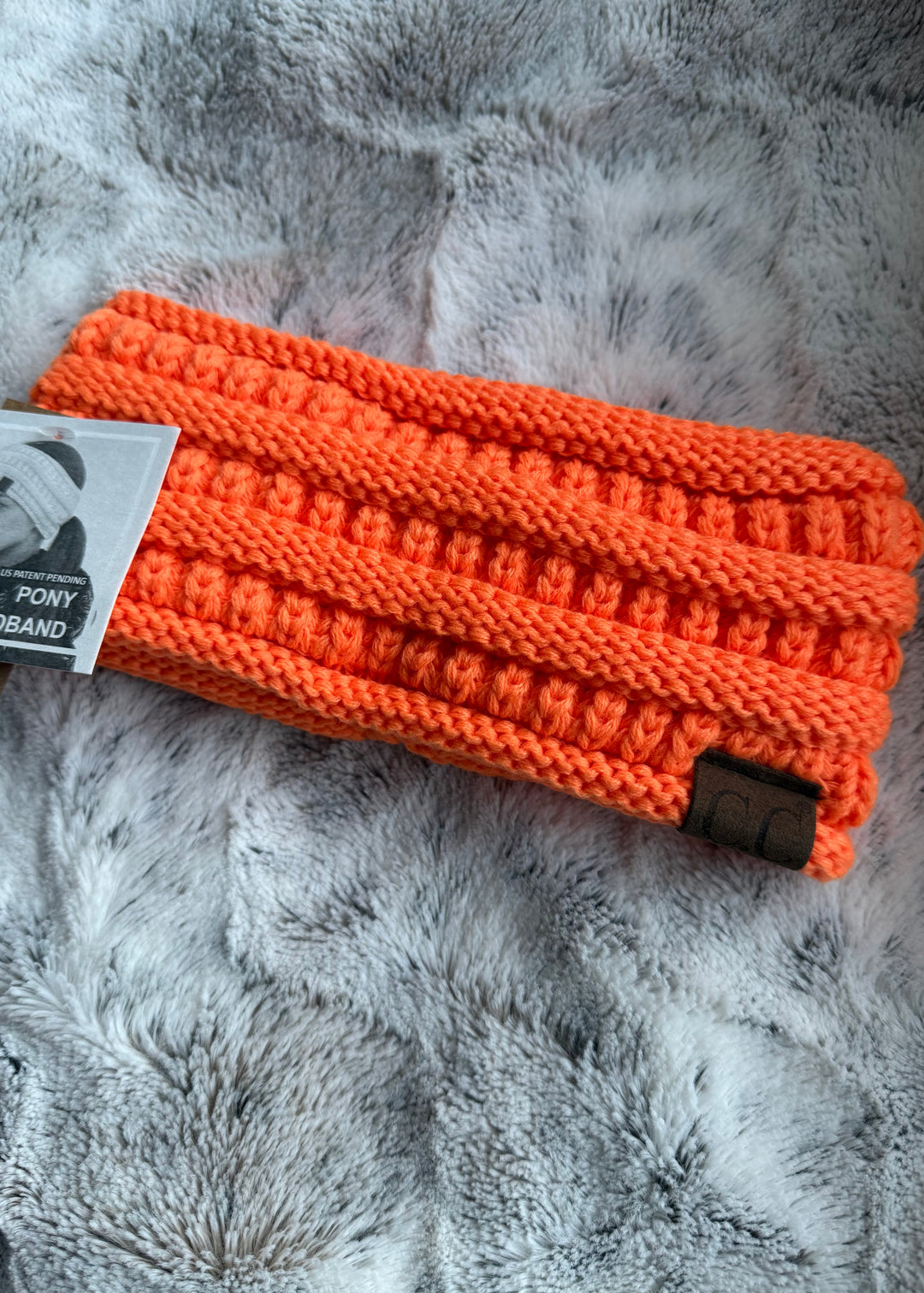 Orange knitted cozy ponytail winter headband