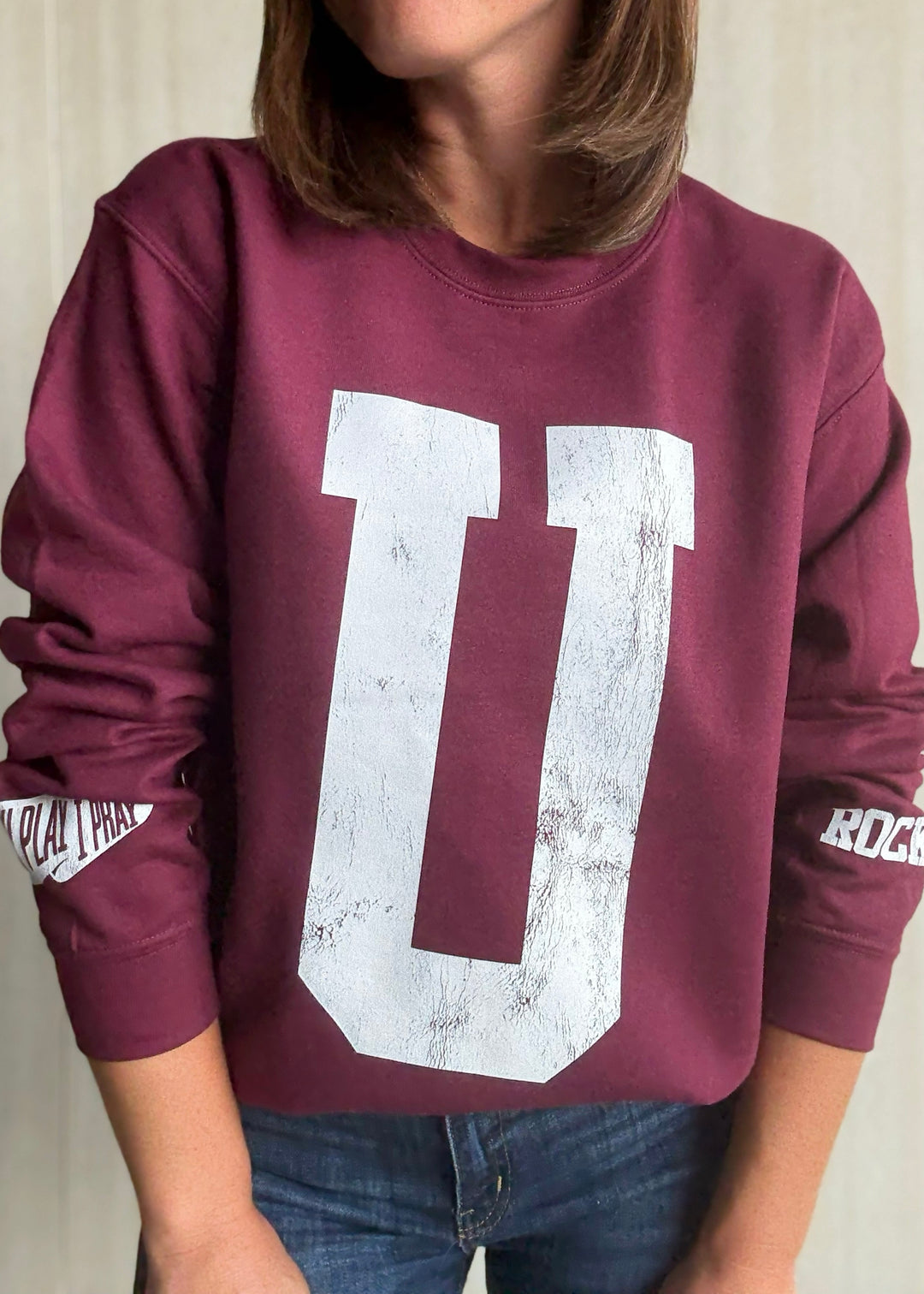 Maroon sweatshirt with a large white 'U' on a neutral background | Women's Unit Rockets Sweatshirt Fanwear