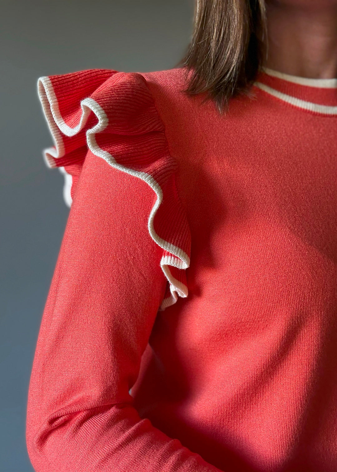 Women's Coral Orange Ruffle Shoulder Sweater with off-white cream stripes | Orange Sweaters for Game Day Outfits