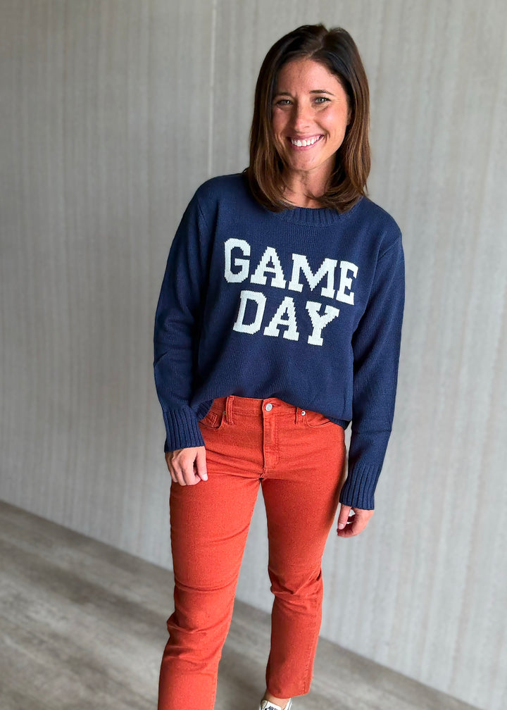 Women's Classic Navy Game Day Sweater with orange jeans
