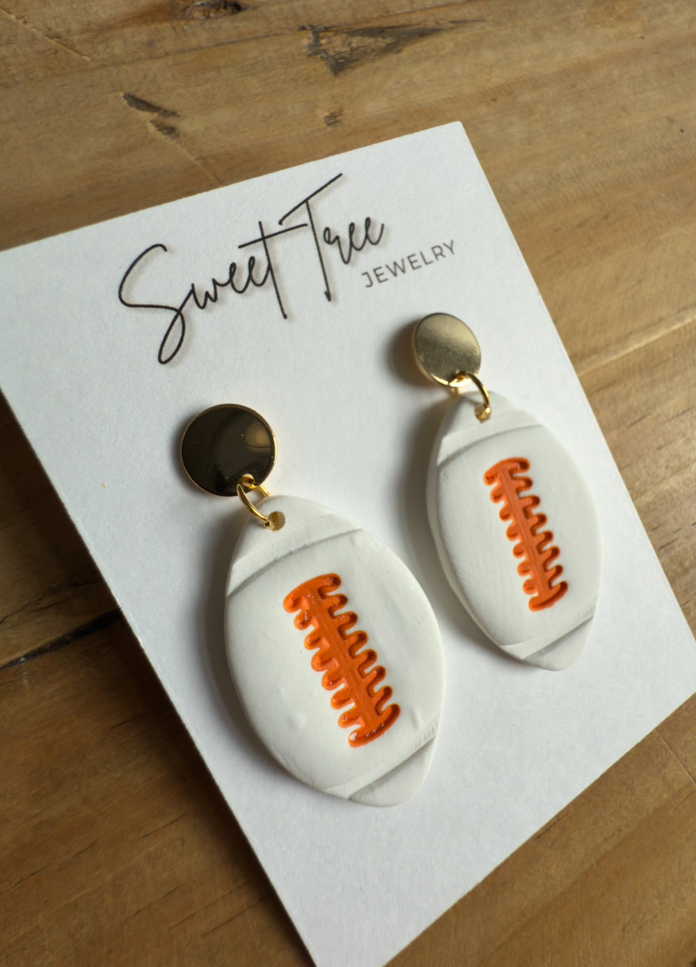 White & Orange Football Dangle Earrings