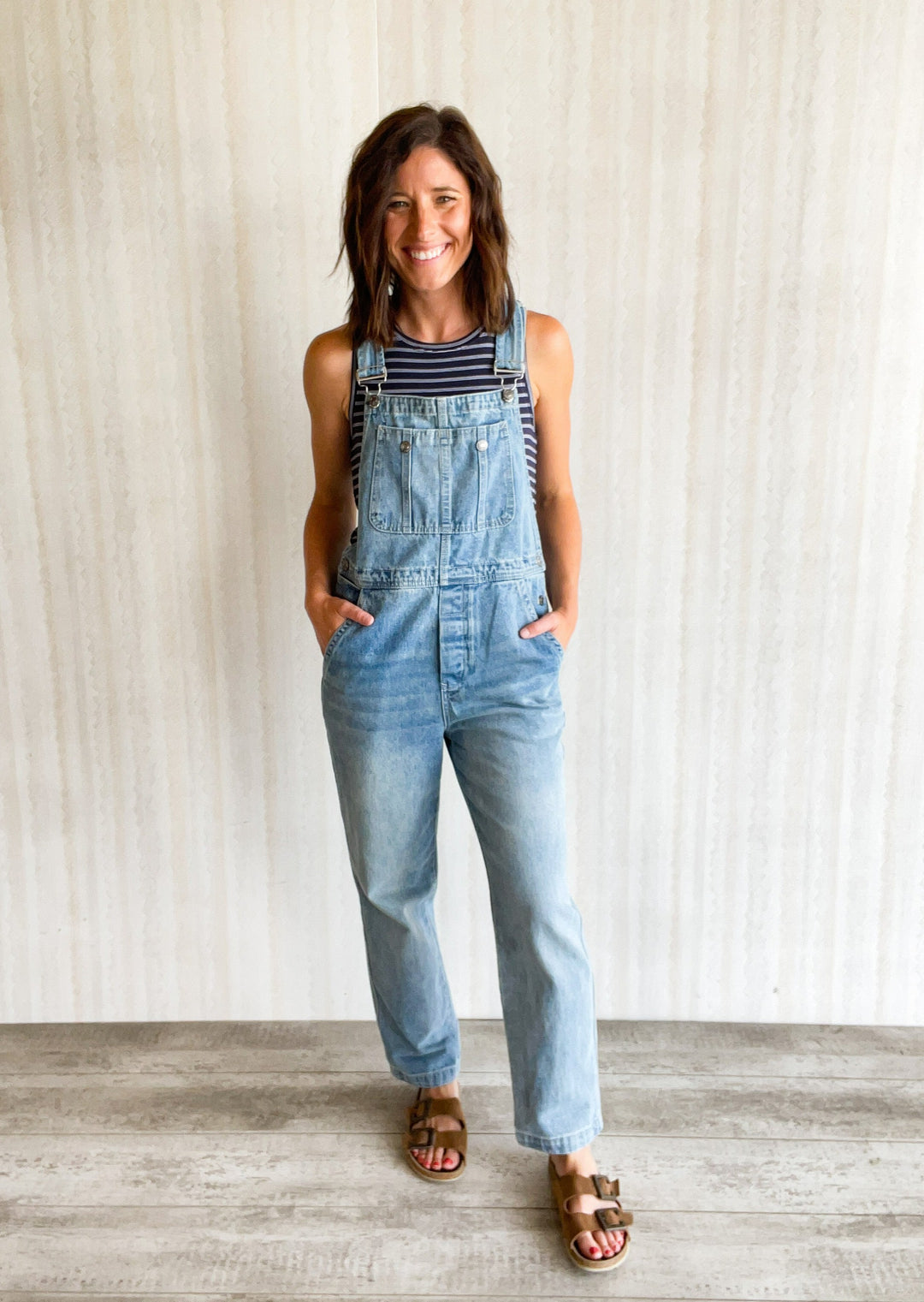Women's Denim Overalls with navy and white striped tank top.