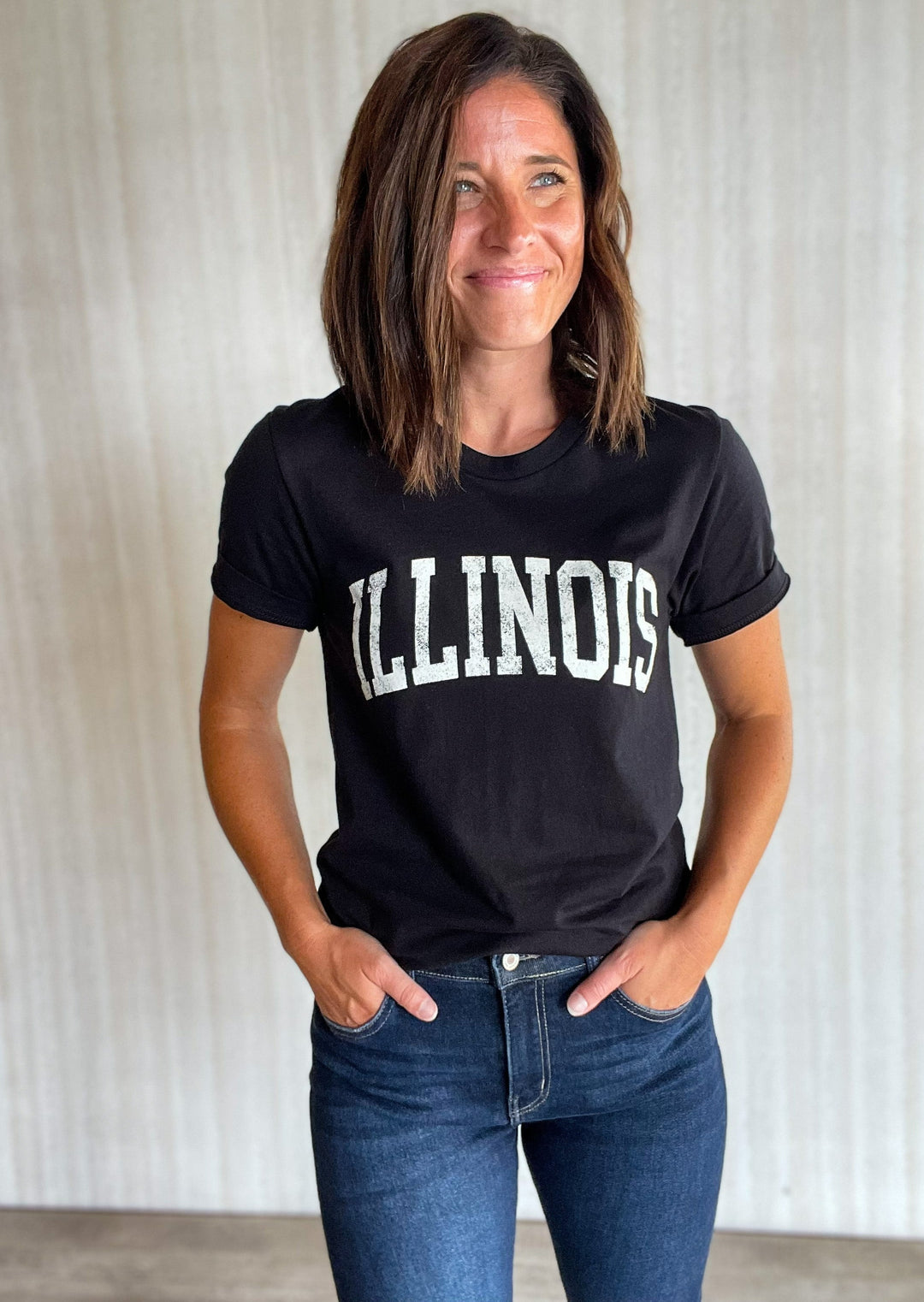 Black Illinois T-Shirt with White Distressed Text that reads "ILLINOIS" | Central Illinois Women's Clothing Boutique