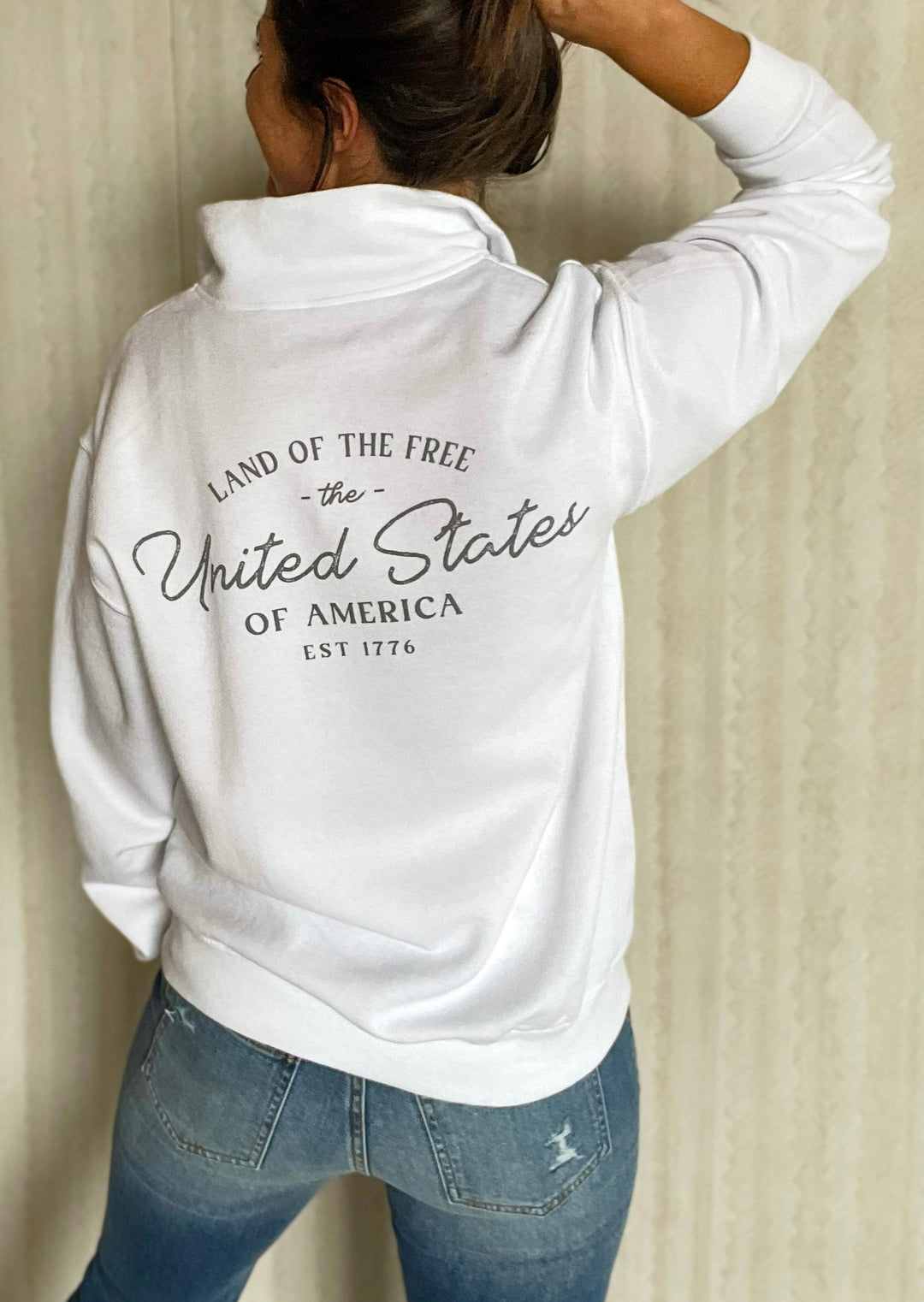 White 1/4 Mock Quarter Zip Sweatshirt with Gray American flag and "Land of the Free, United States of America, EST 1776" text. 