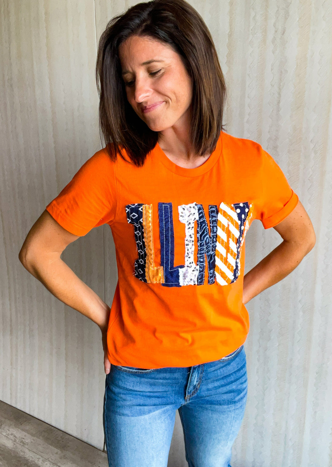Orange Illinois T-shirt with navy, orange, and white sparkly letters.