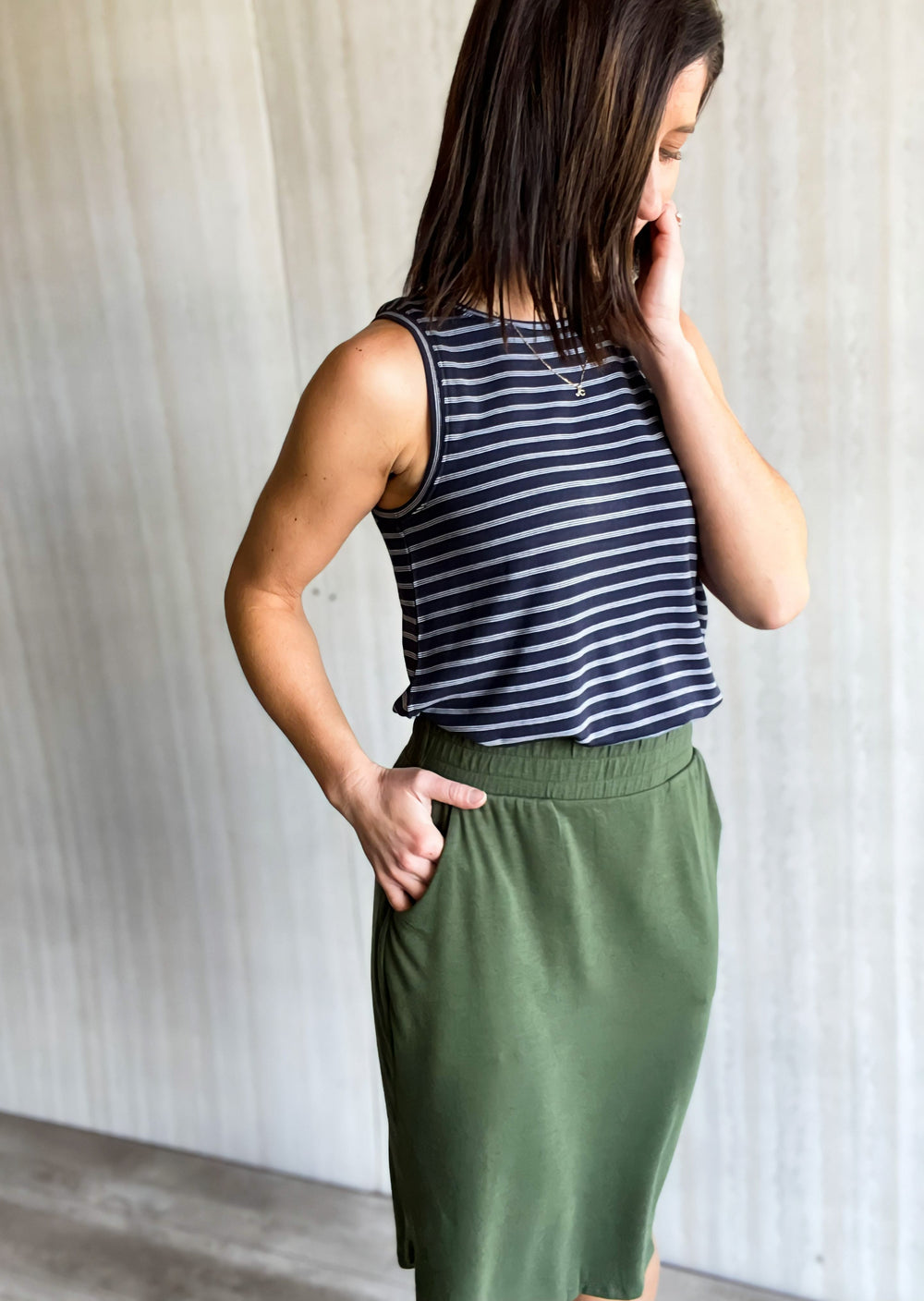 Army Green Tulip Hem Skirt with pockets paired with a navy and white tank top