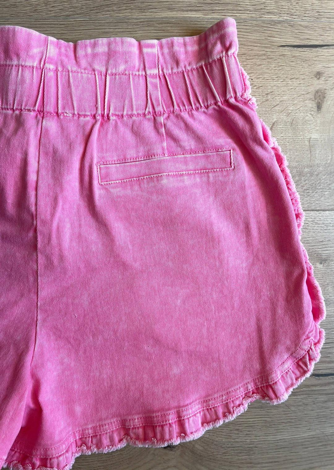 Pink Pleated Shorts at Embolden. What the back side looks like.