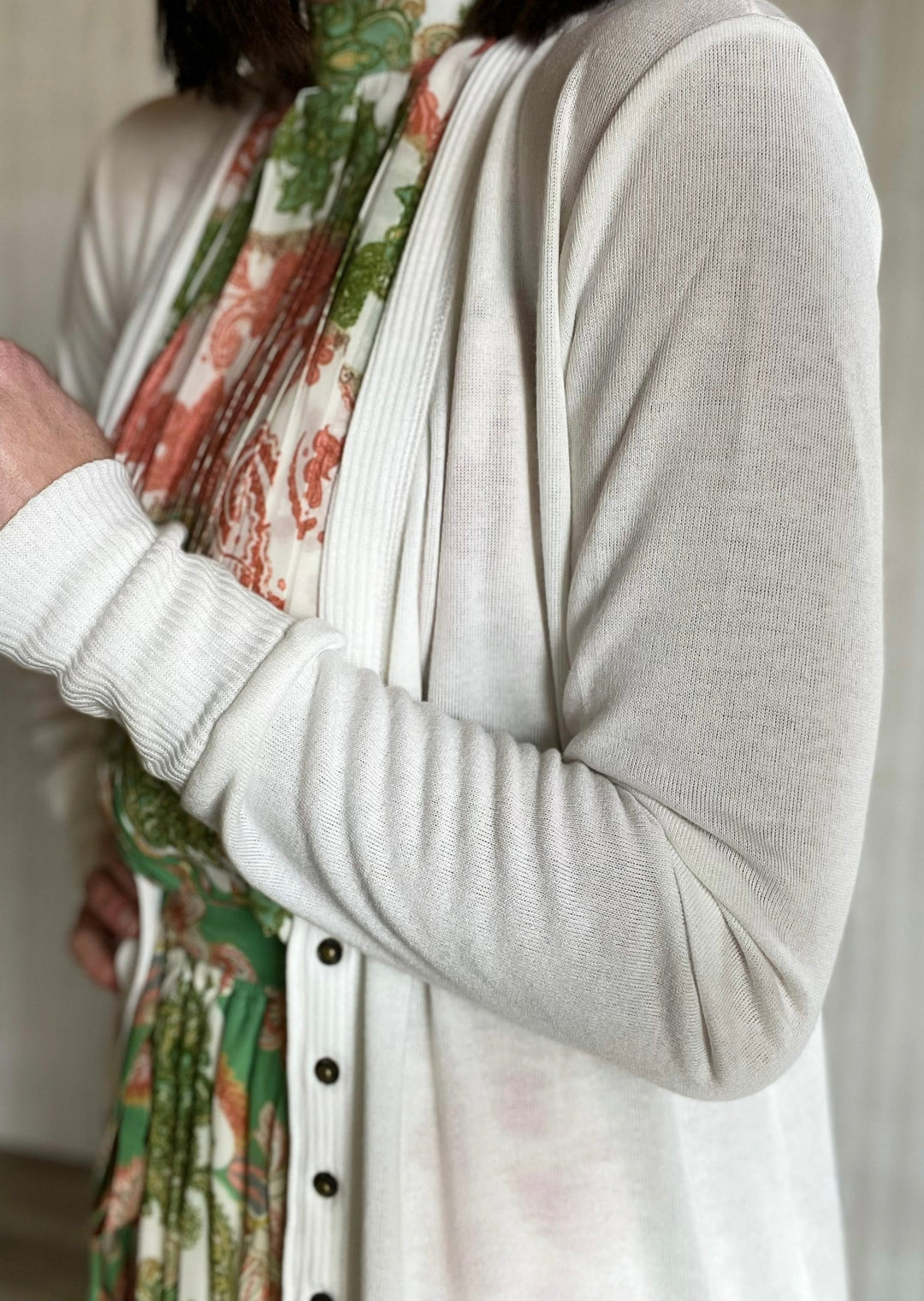 Ivory White Long Cardigan with snap buttons with floral maxi pleated dress.