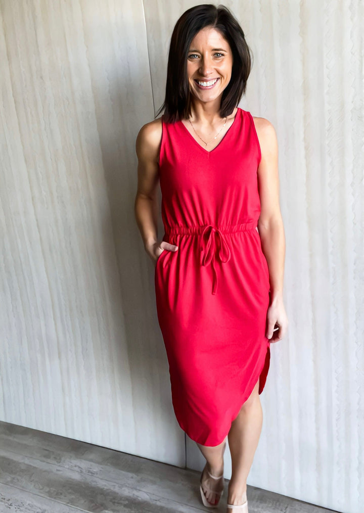 Ruby red v-neck dress with drawstring tie waist and slit on each side.