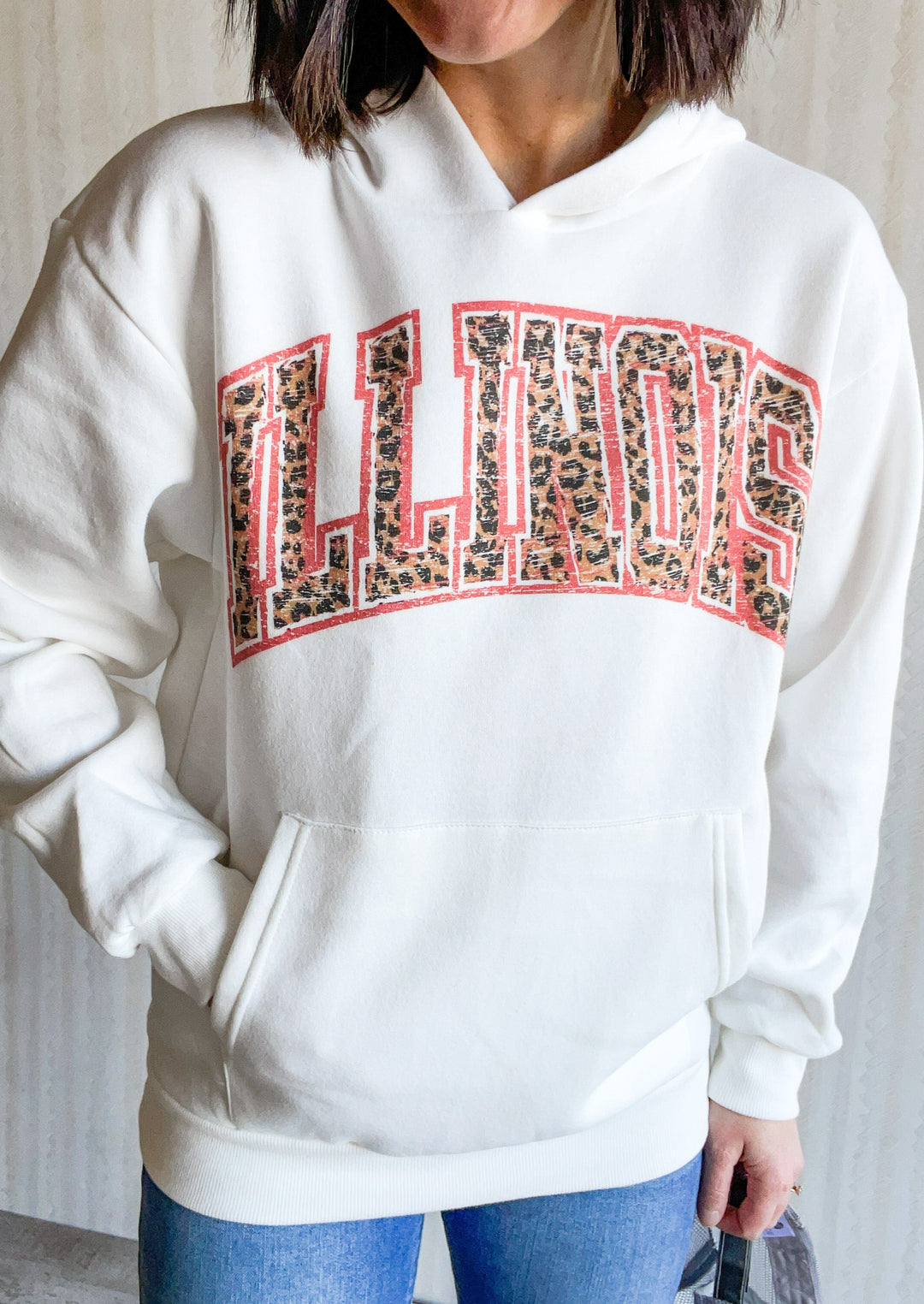 Illinois Hoodie White Sweatshirt with Illinois text across the chest in a leopard print with orange outline