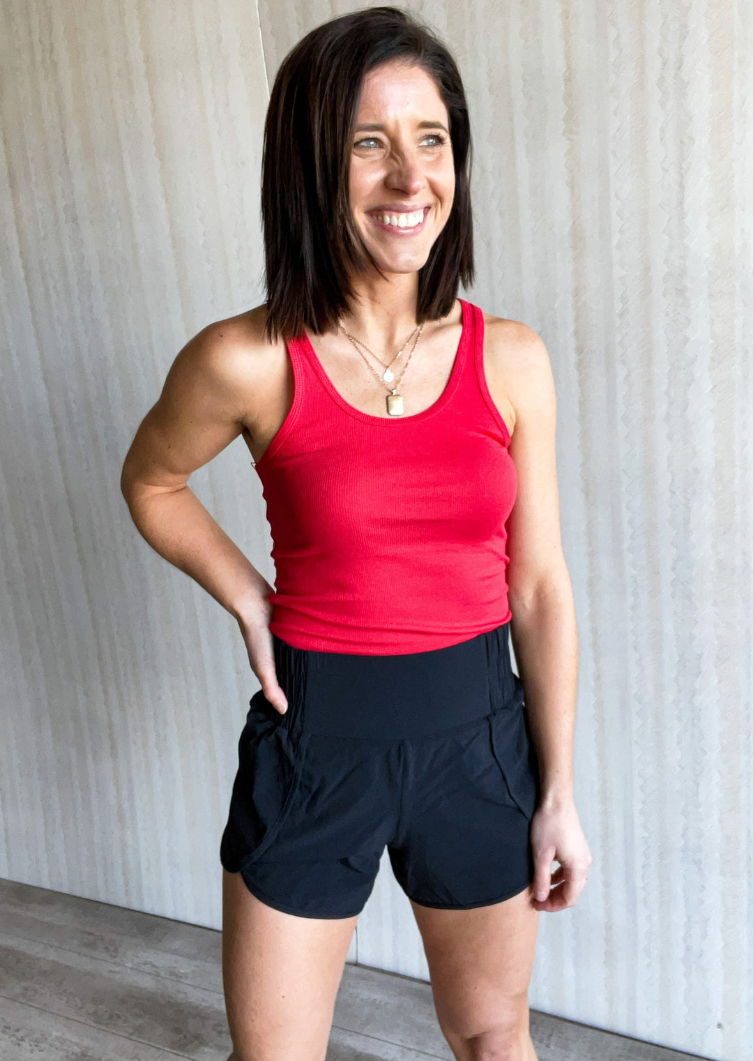 Red Racerback Tank Top with black shorts