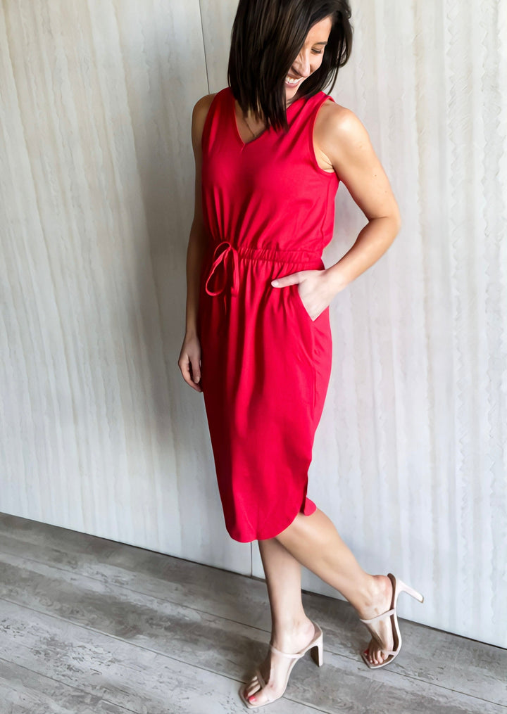 Ruby red v-neck dress with drawstring tie waist and slit on each side.