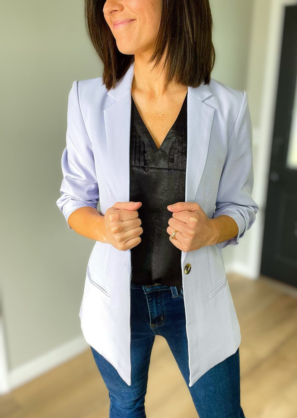 Lavendar Blazer over a black sleeveless blouse with flying monkey kick flare jeans