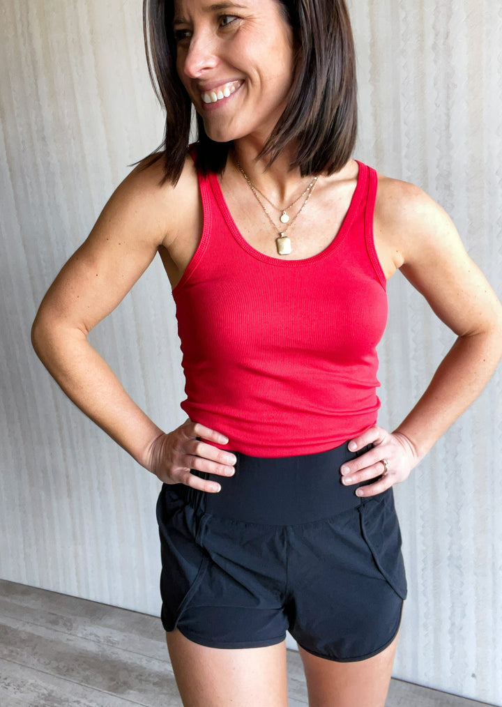 Red Racerback Tank Top with black shorts