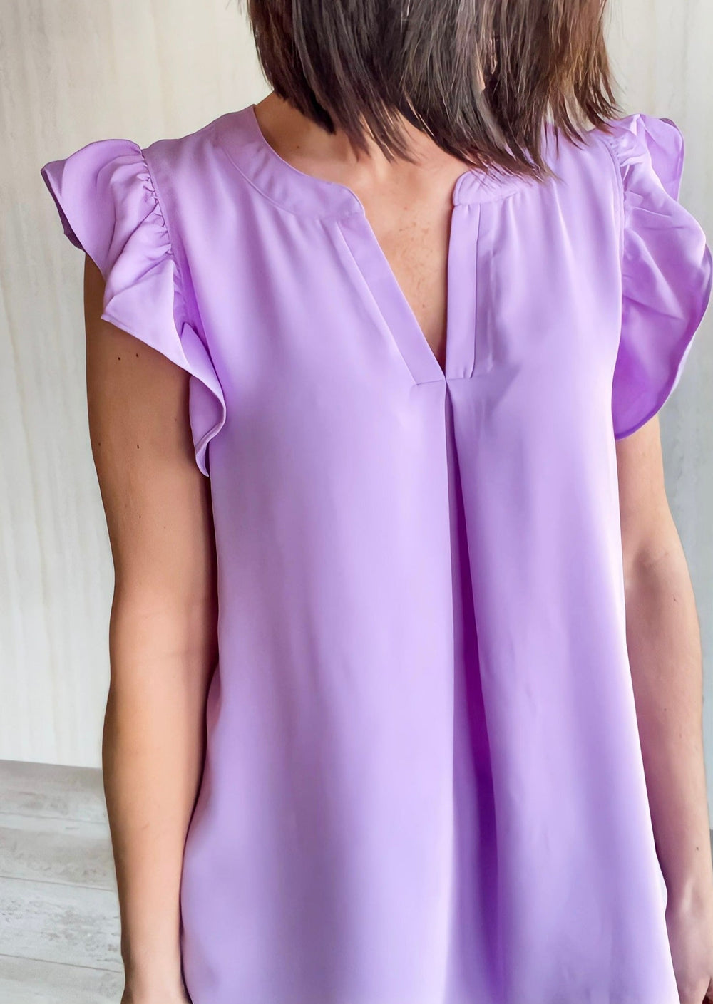 Lavender Ruffle Sleeve Dress Top paired with Black Dress Pants