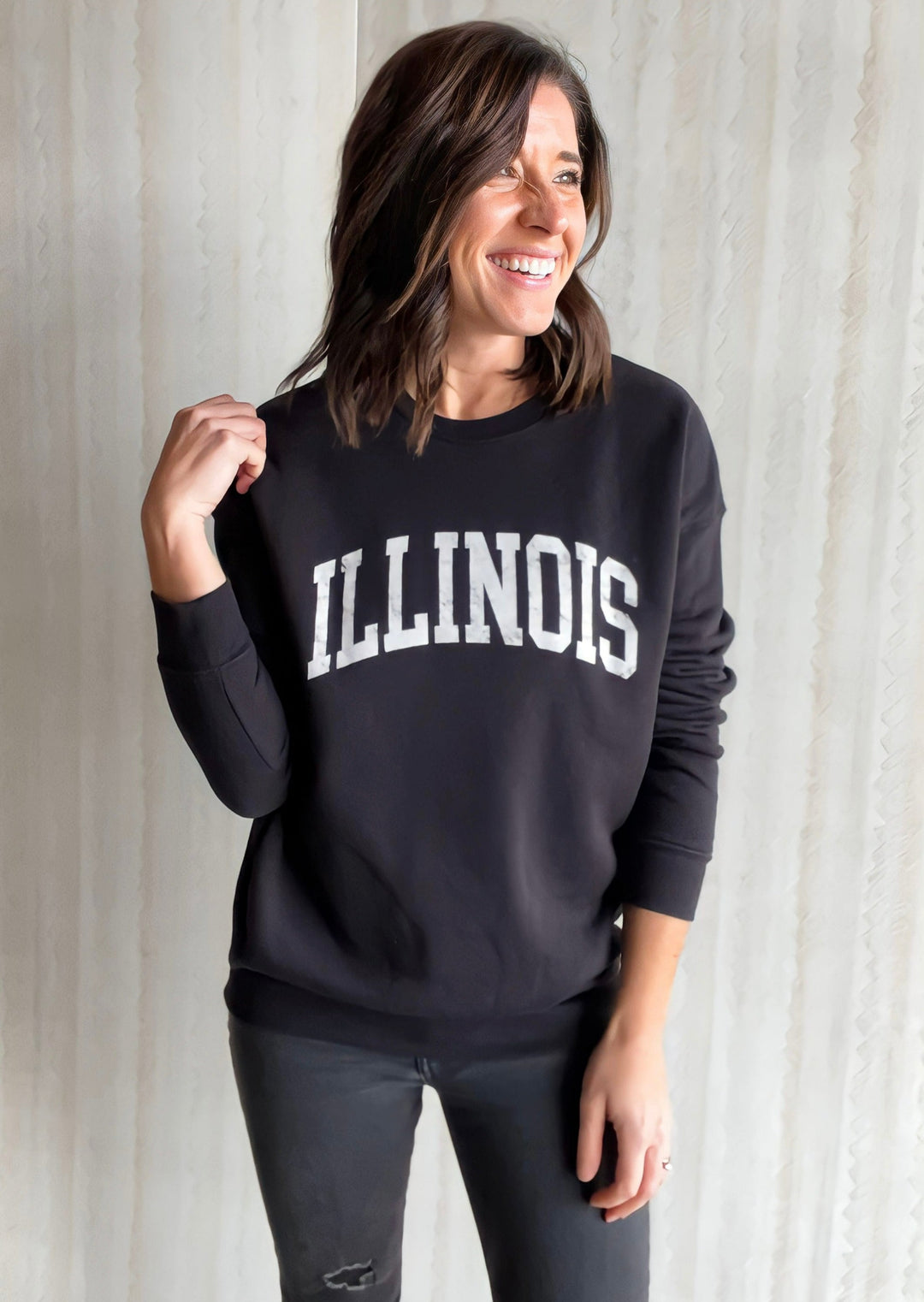 Women's Black Illinois Crewneck Sweatshirt with White distressted text from Champaign, Illinois Embolden Boutique.