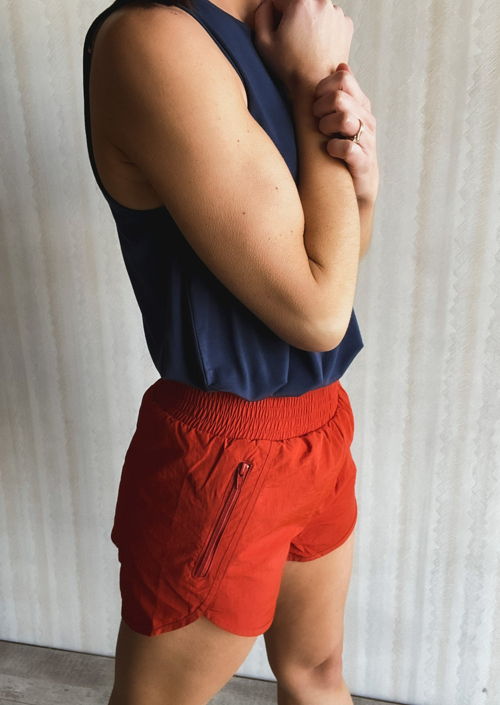 Orange Copper Smocked Waist Shorts with Navy Tank Top