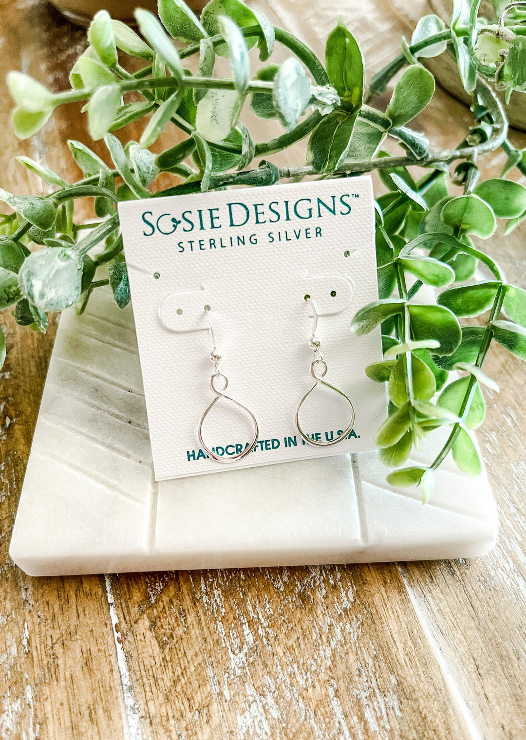 Sterling Silver Earrings with a fluid and feminine eternity design. Made in the U.S.A.
