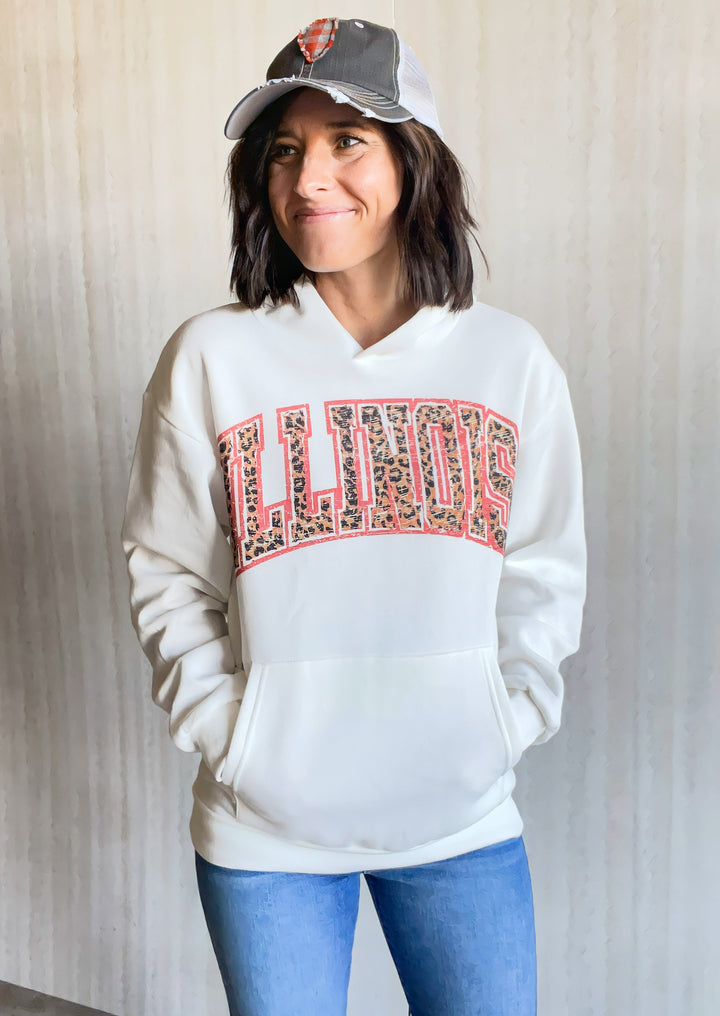 Illinois Hoodie White Sweatshirt with Illinois text across the chest in a leopard print with orange outline
