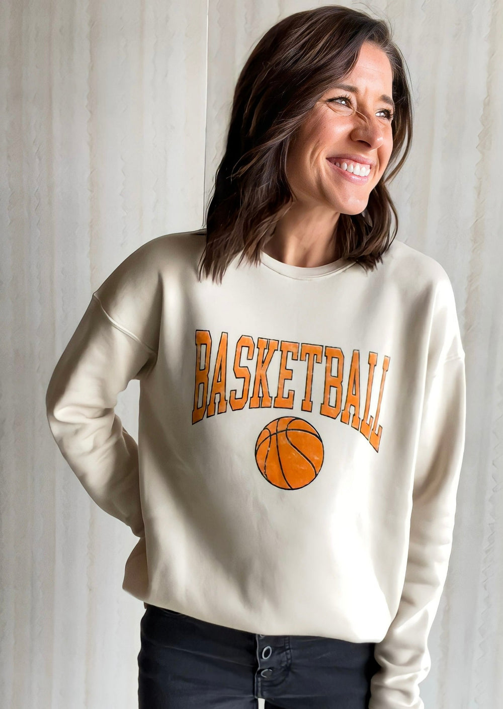 Women's Neutral Basketball Sweatshirt. Cream Sweatshirt with Basketball text and grahic in light orange. Sweatshirt from Champaign-Urbana, Illinois Embolden boutique.