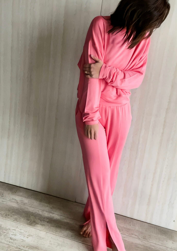 Women's Pink Athleisure Loung Set with split leg pants and a crossover detail pullover top.