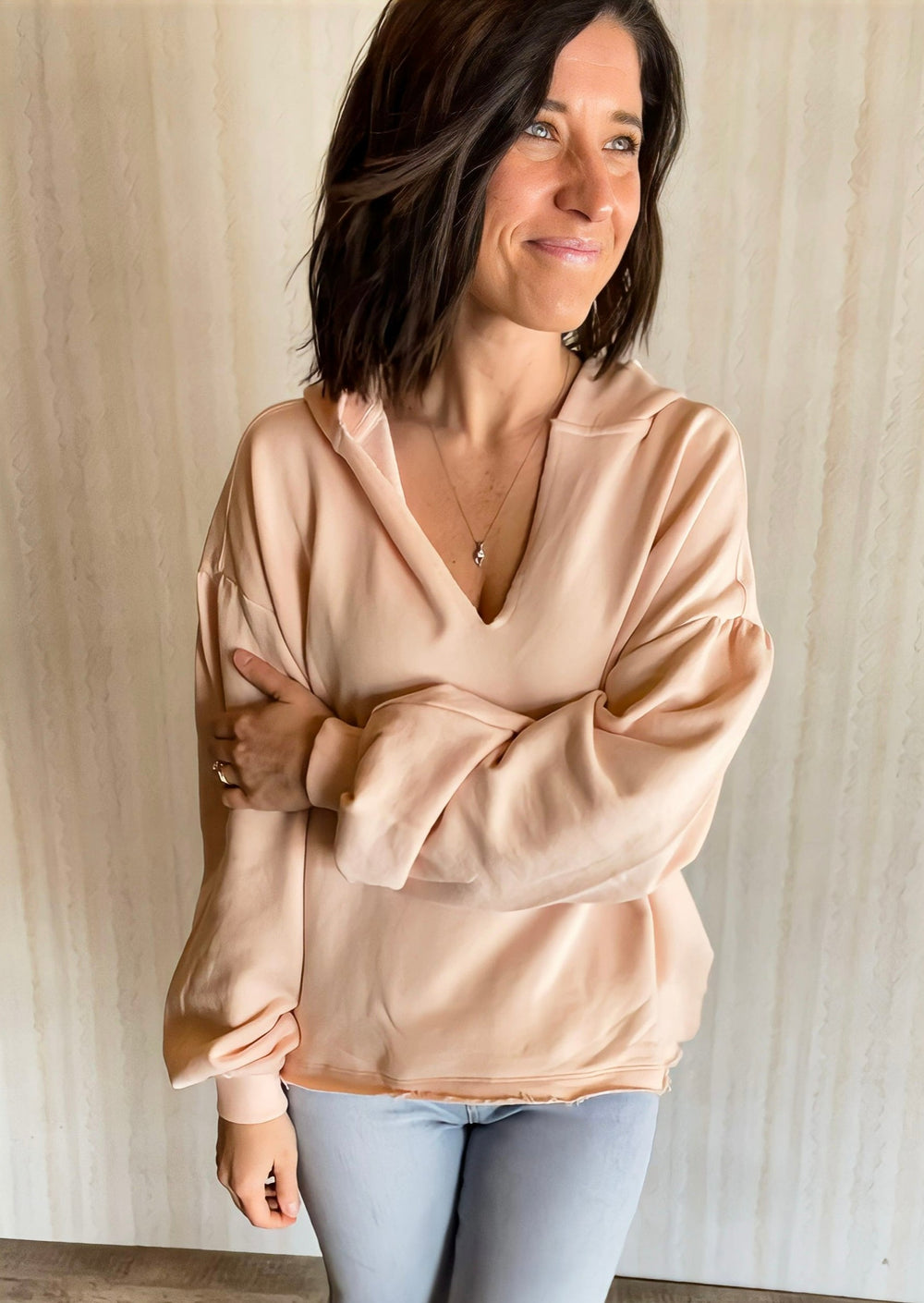 Light Pink Cotton French Terry Oversized Hoodie with balloon sleeves, v-neck, distressed hems, and a cropped waist.